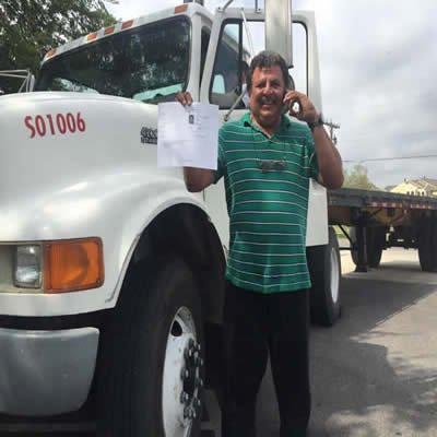 CDL Training Texas flyer in English and Spanish showing $2300 payment plan, bilingual instructors, and contact info for locations in Dallas, Houston, San Antonio, Fort Worth, and Pasadena.